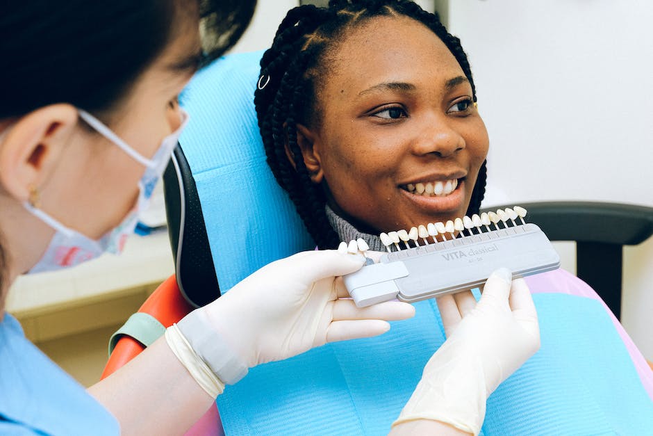An image of a dental implant installation procedure with a patient and a dentist.